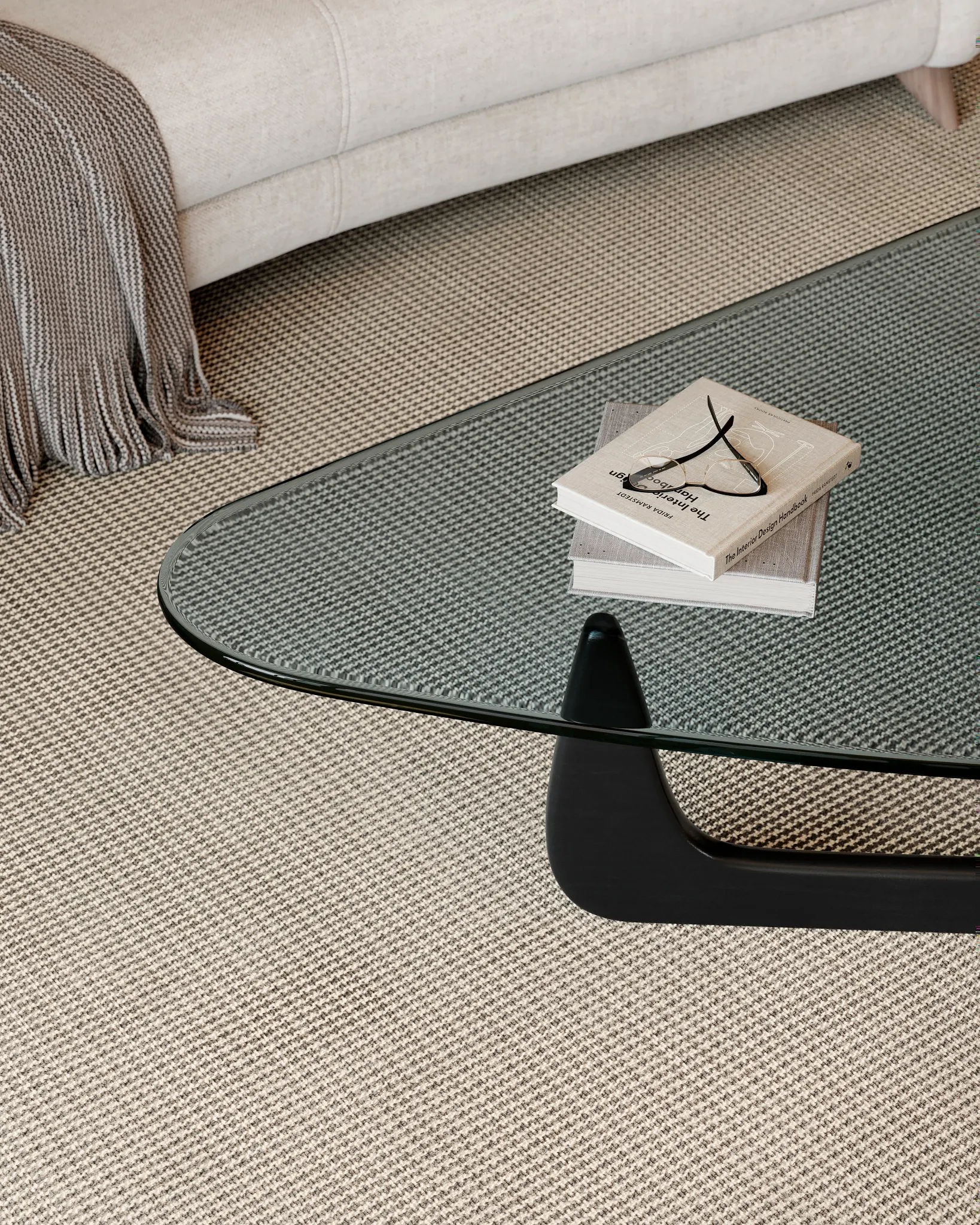 Modern living room with a glass coffee table on a 100% wool carpet in beige and gray tones