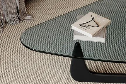 100% Wool Carpet in Beige and Gray for Modern Living Room Decor Modern living room with a glass coffee table on a 100% wool carpet in beige and gray tones