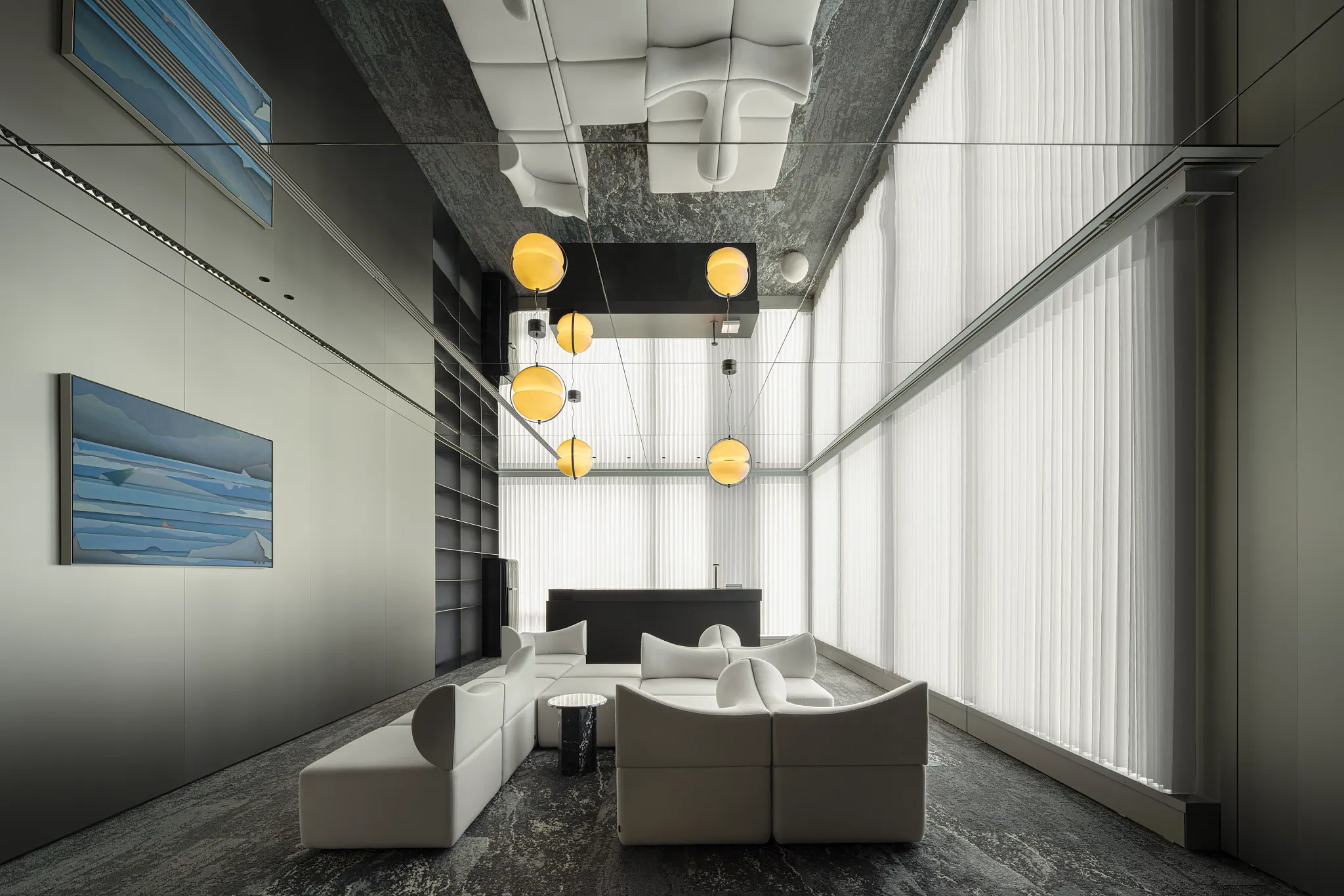 Modern office interior with dark walls and abstract artwork