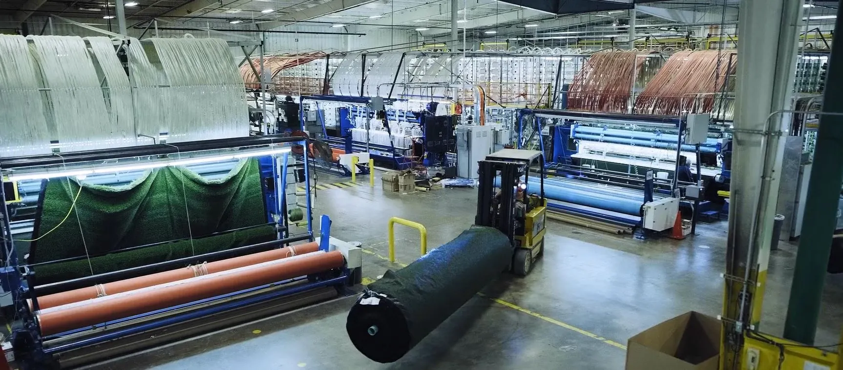 Industrial carpet manufacturing facility with machinery