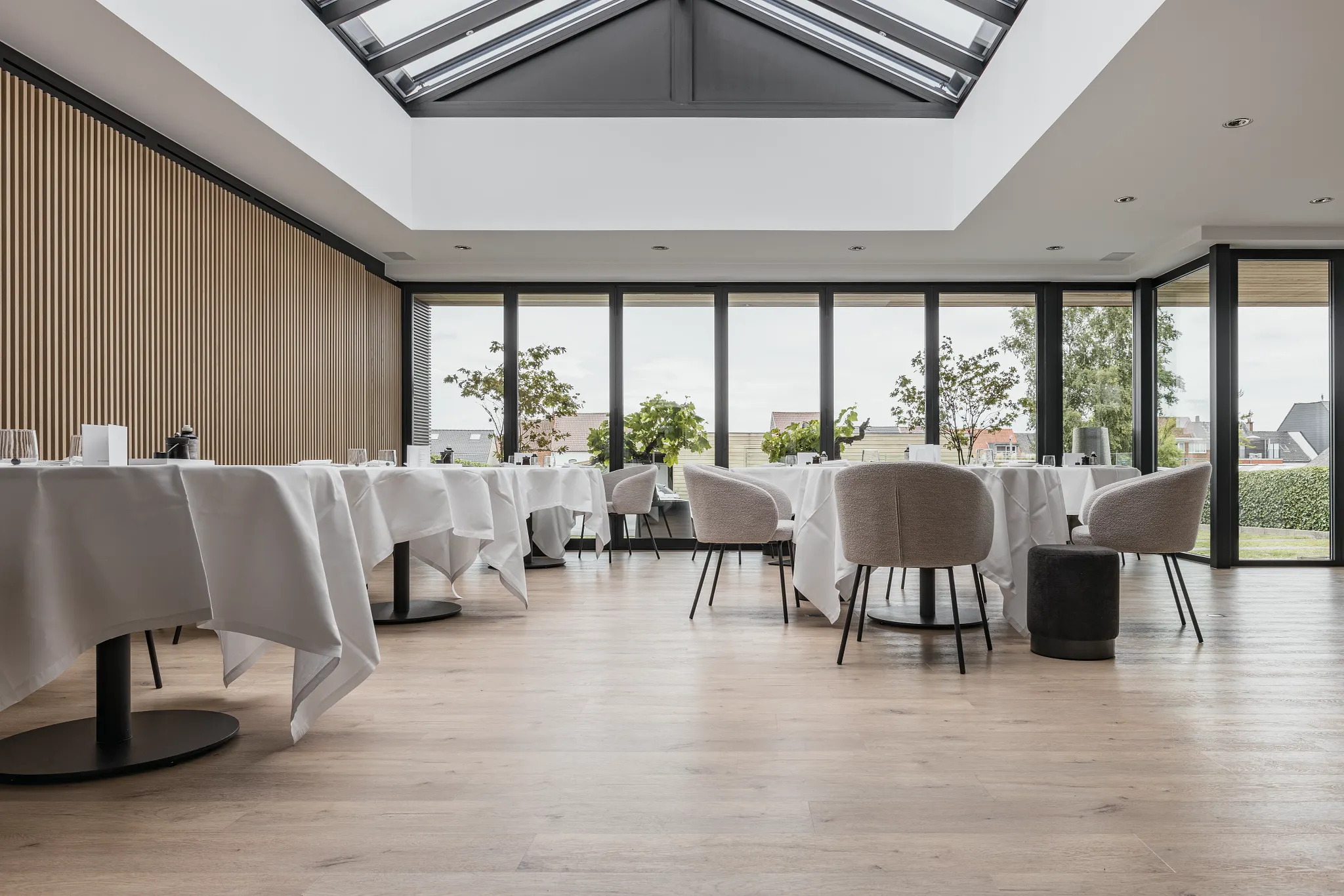 Modern dining area with luxury vinyl flooring and elegant seating