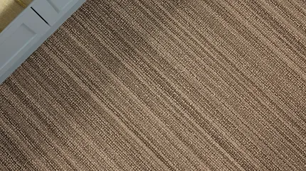 100% Wool Carpet in Beige and Gray for Modern Living Room Decor Modern living room with a glass coffee table on a 100% wool carpet in beige and gray tones