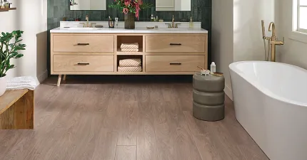 minimalist mid-century modern style living room with COREtec luxury vinyl flooring modern bathroom featuring soaker tub, deep green tile and COREtec vinyl flooring