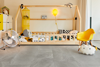 A child's room with yellow and white furniture on COREtec vinyl flooring.