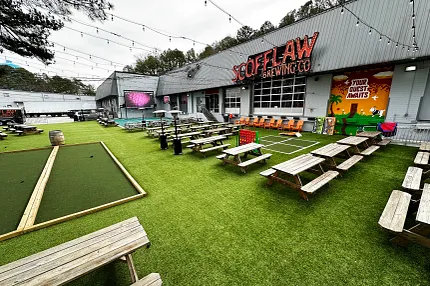 Vibrant outdoor space with synthetic turf at Scofflaw Brewing Co Outdoor seating area with artificial grass at Scofflaw Brewing Co