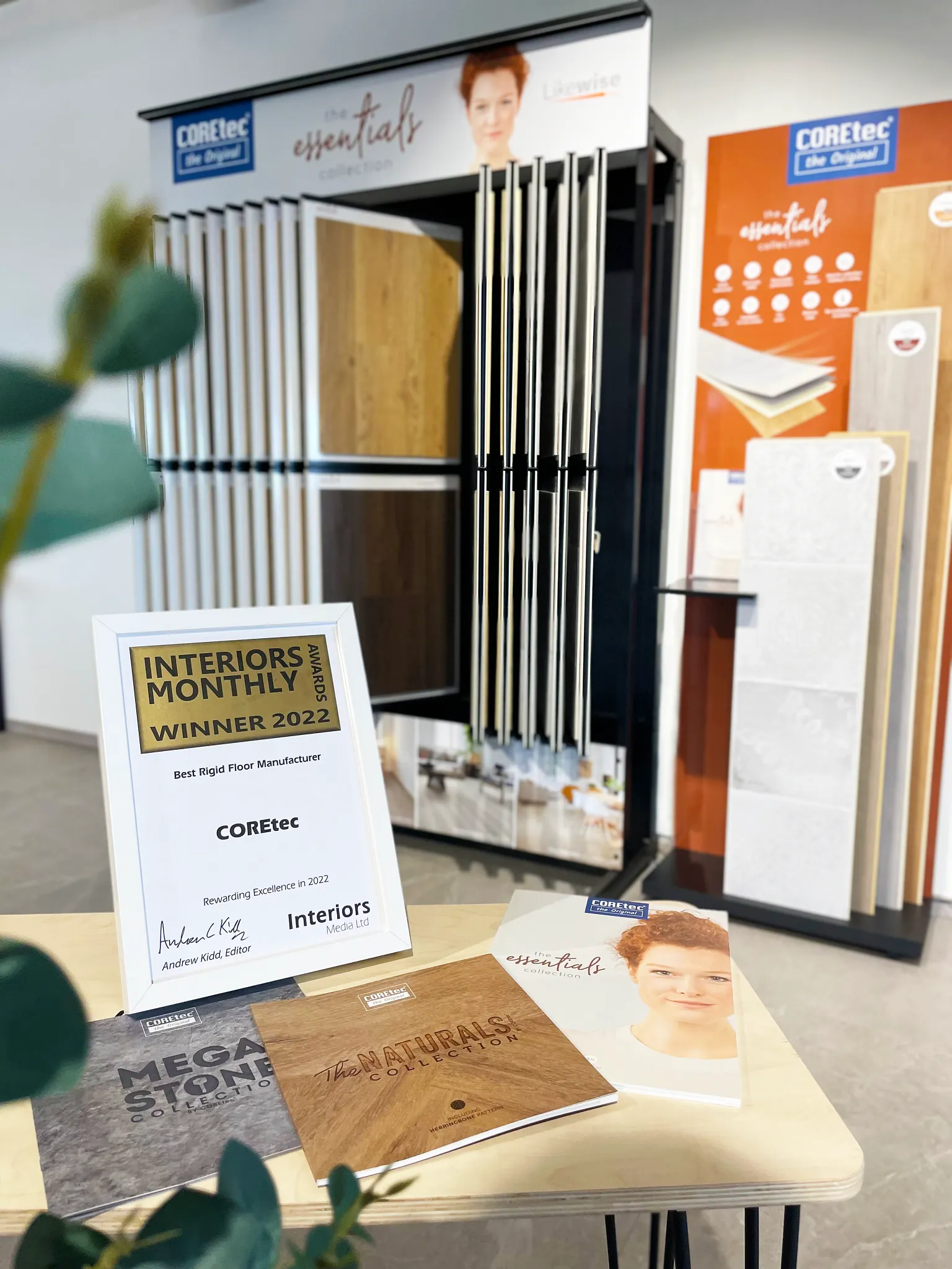 Display of COREtec flooring collections with award certificate for Best Rigid Floor Manufacturer 2022