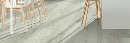 Light Oak Vinyl Flooring in Modern Home Office - Durable and Easy to Maintain Modern home office with light oak vinyl flooring, featuring a sleek desk, chair, and indoor plants for a cozy and practical workspace