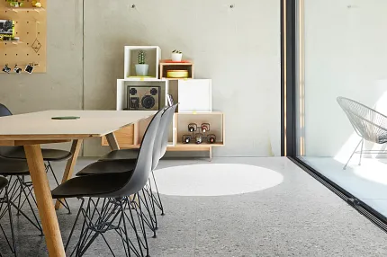 Grey Stone Look Luxury Vinyl Tile Flooring in Modern Dining Room Modern dining room with large windows featuring stone look luxury vinyl tile flooring in a grey color