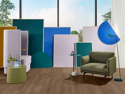 LVT flooring can be used in apartments, townhomes or senior living communities LVT flooring displayed in brightly colored sitting area