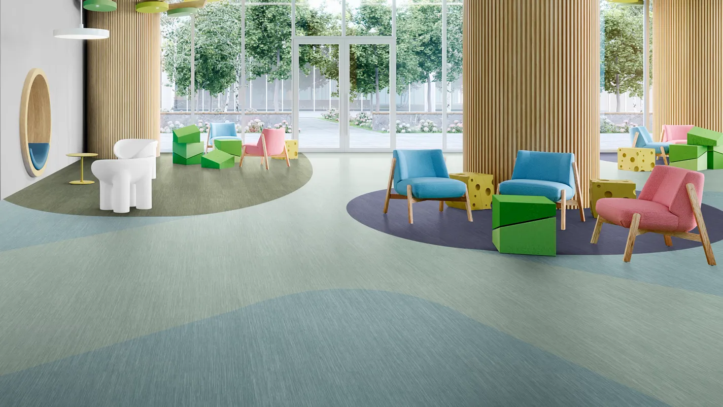Kids waiting area in a healthcare setting with light green and light blue luxury vinyl tile