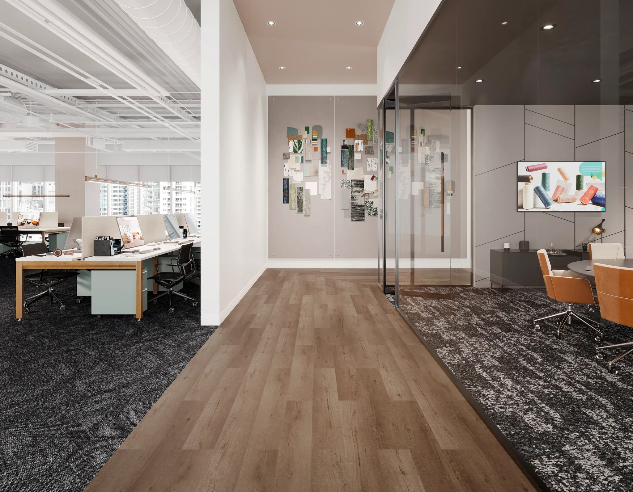 Modern office space with light brown luxury vinyl tile flooring and dark patterned carpet tiles, featuring open workstations and a glass-walled meeting room
