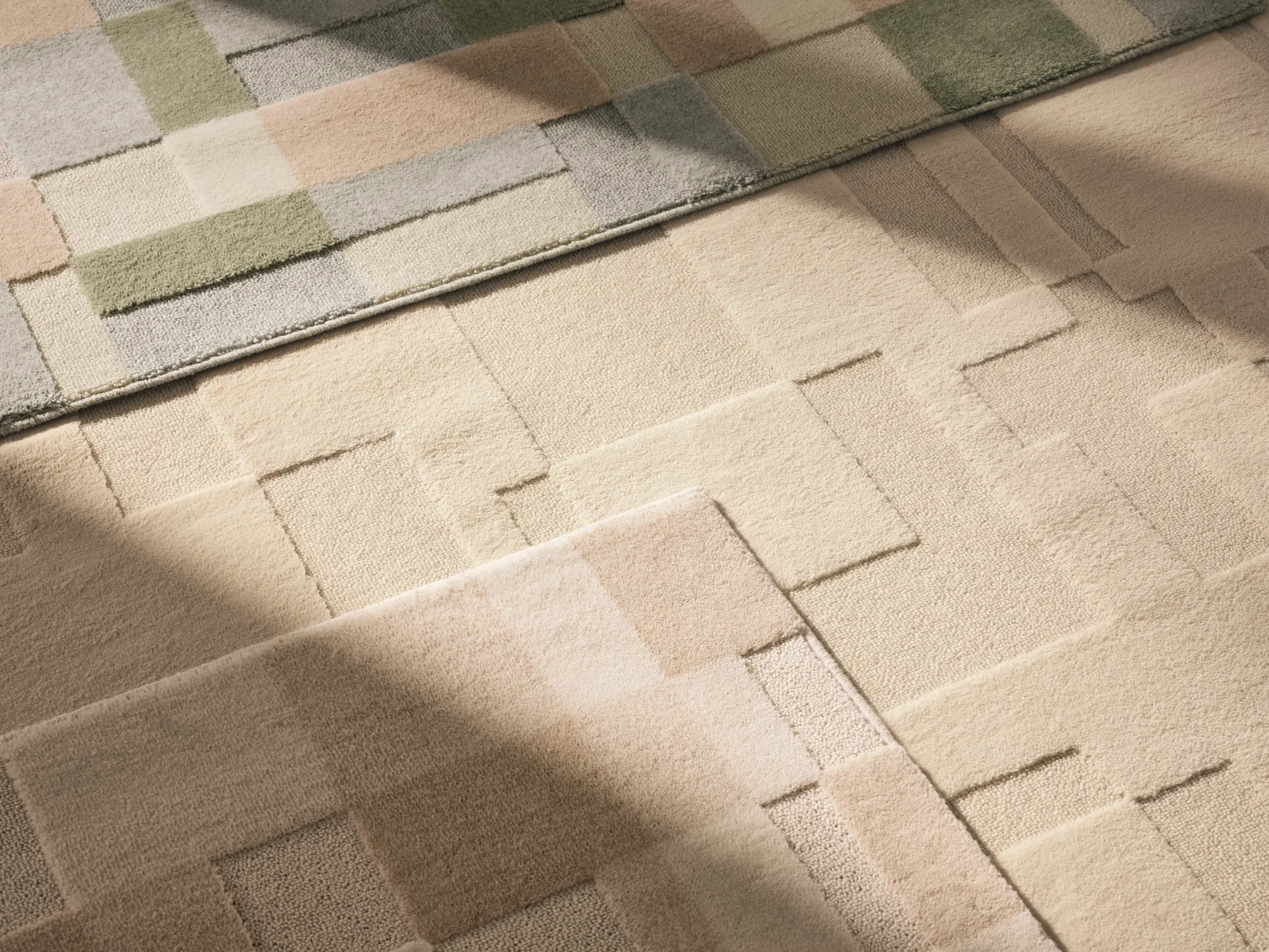 Textured carpet swatches in beige, green, and gray tones