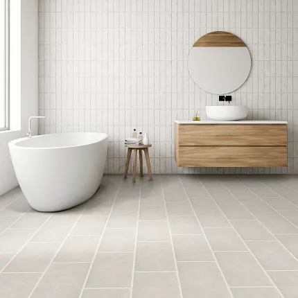 Contemporary bathroom design with durable light beige tile flooring Modern bathroom with white freestanding bathtub, wooden vanity, and light beige tile flooring