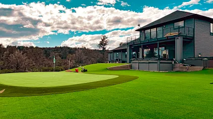 Premium artificial grass for residential landscapes Modern house with lush green artificial turf lawn