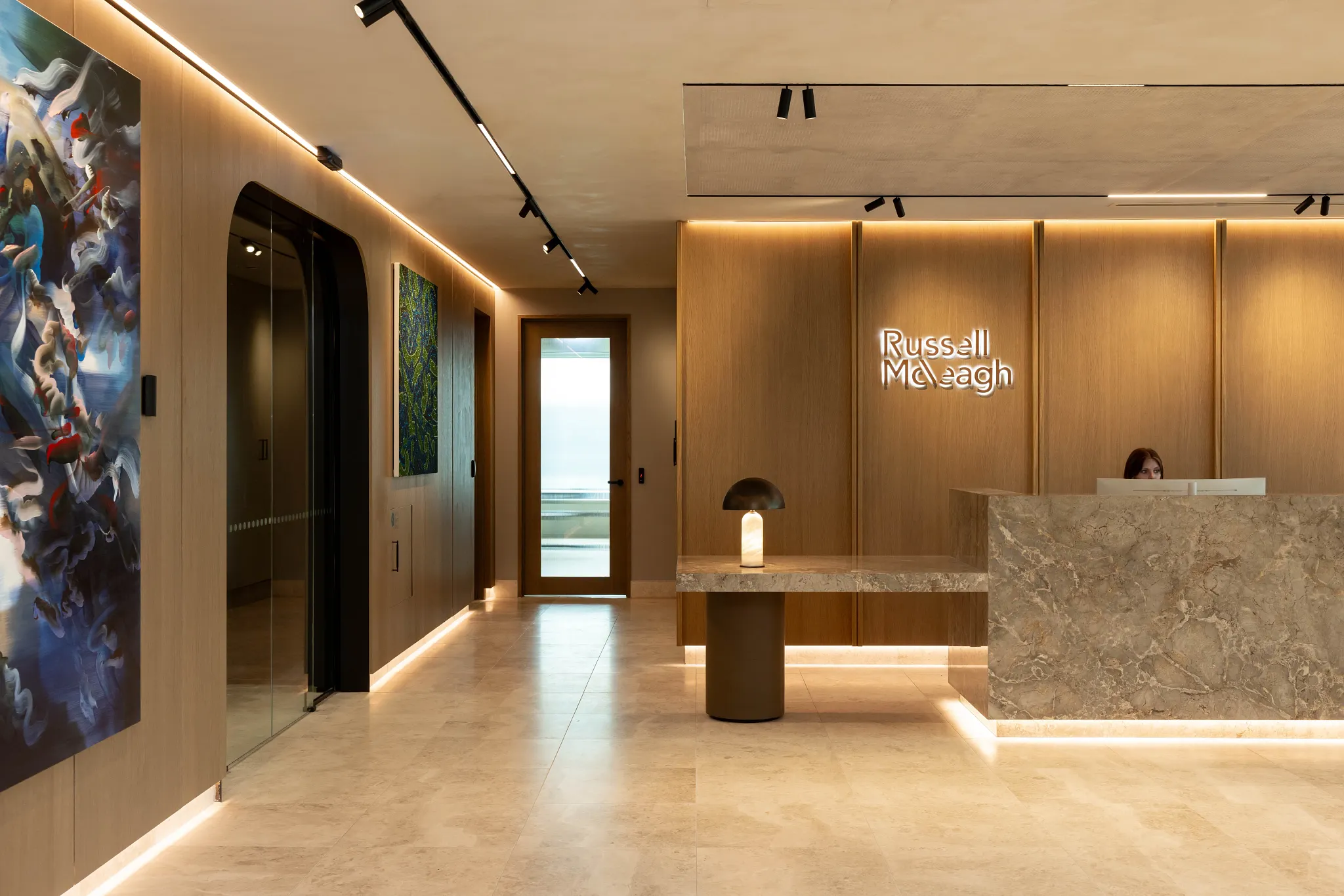 Modern office reception with beige tile flooring