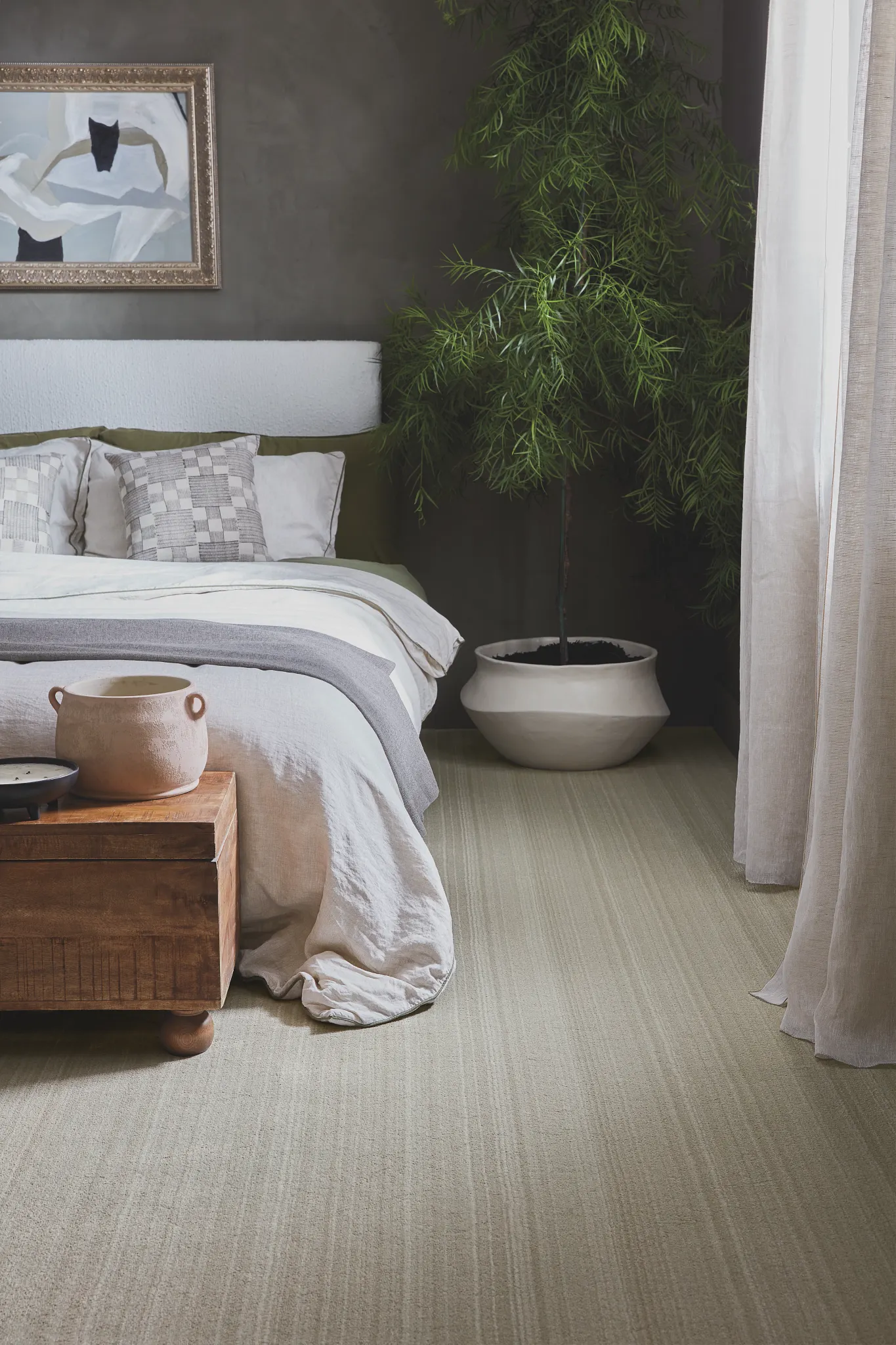 Modern bedroom featuring a broadloom carpet in light gray