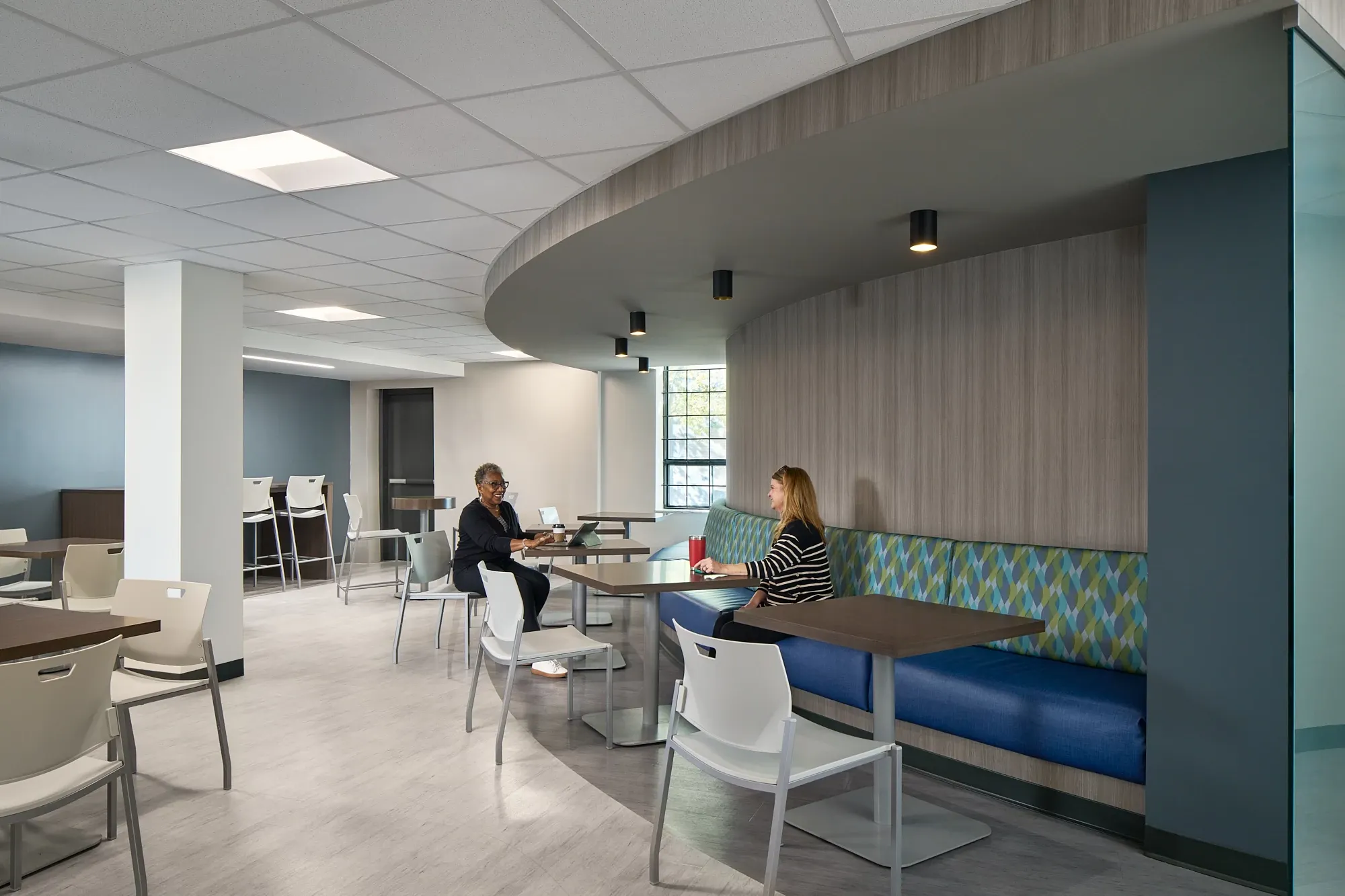 Modern education facility with light wood flooring and seating area