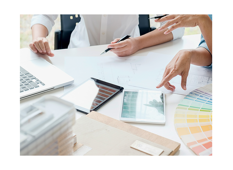 Office laid out with color swatches and blueprints