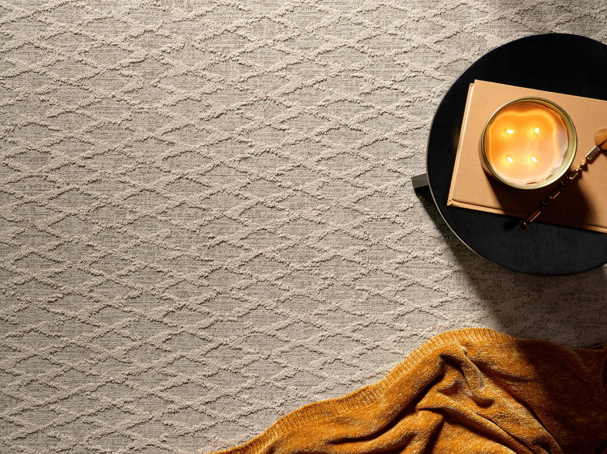 Close-up view of a textured broadloom carpet in beige