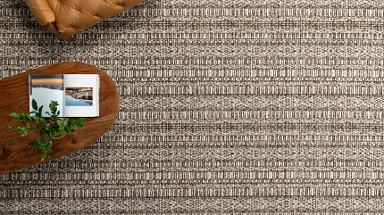 High-Quality Brown and Beige Textured Carpet Flooring - Durable Home Decor Close-up view of textured carpet flooring in shades of brown and beige