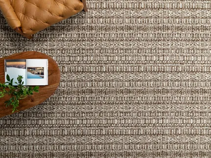 High-Quality Brown and Beige Textured Carpet Flooring - Durable Home Decor Close-up view of textured carpet flooring in shades of brown and beige
