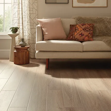 Coretec Residential WPC Luxury Vinyl Plank Flooring in Living Room Scene living room with beige sofa and luxury vinyl plank floor in a wood look
