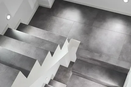 Grey Stone Look Luxury Vinyl Tile Flooring on Stairs - Durable and Stylish Modern staircase with grey stone look luxury vinyl tile flooring