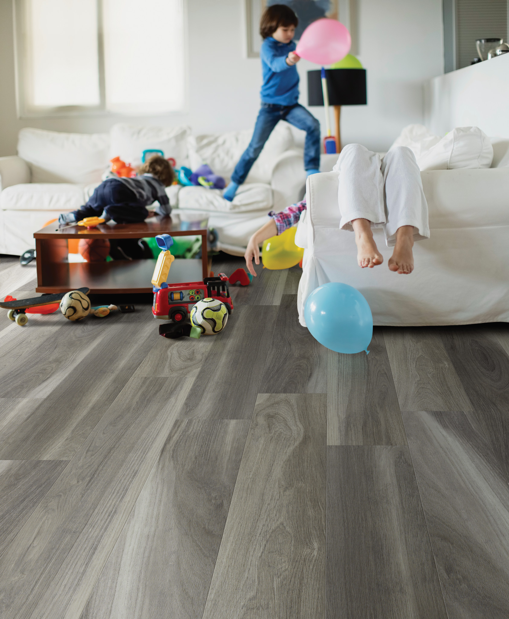 Kids playing in a messy livng room