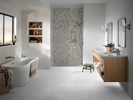 Coretec Residential WPC Luxury Vinyl Tile Flooring in Modern Bathroom - 24.02x12.01 inch Modern bathroom with Coretec Residential WPC luxury vinyl tile flooring in a light stone look, featuring a freestanding bathtub, wooden vanity, and glass shower, 24.02x12.01 inch dimensions