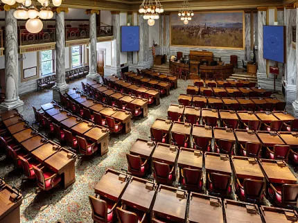 Elegant interior design for government spaces Ornate government facility with detailed ceiling and carpet flooring