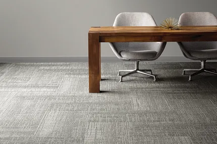 Stylish gray carpet tiles for contemporary office spaces Modern office with gray carpet tiles and wooden desk