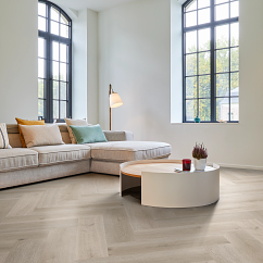 A room with herringbone luxury vinyl flooring.