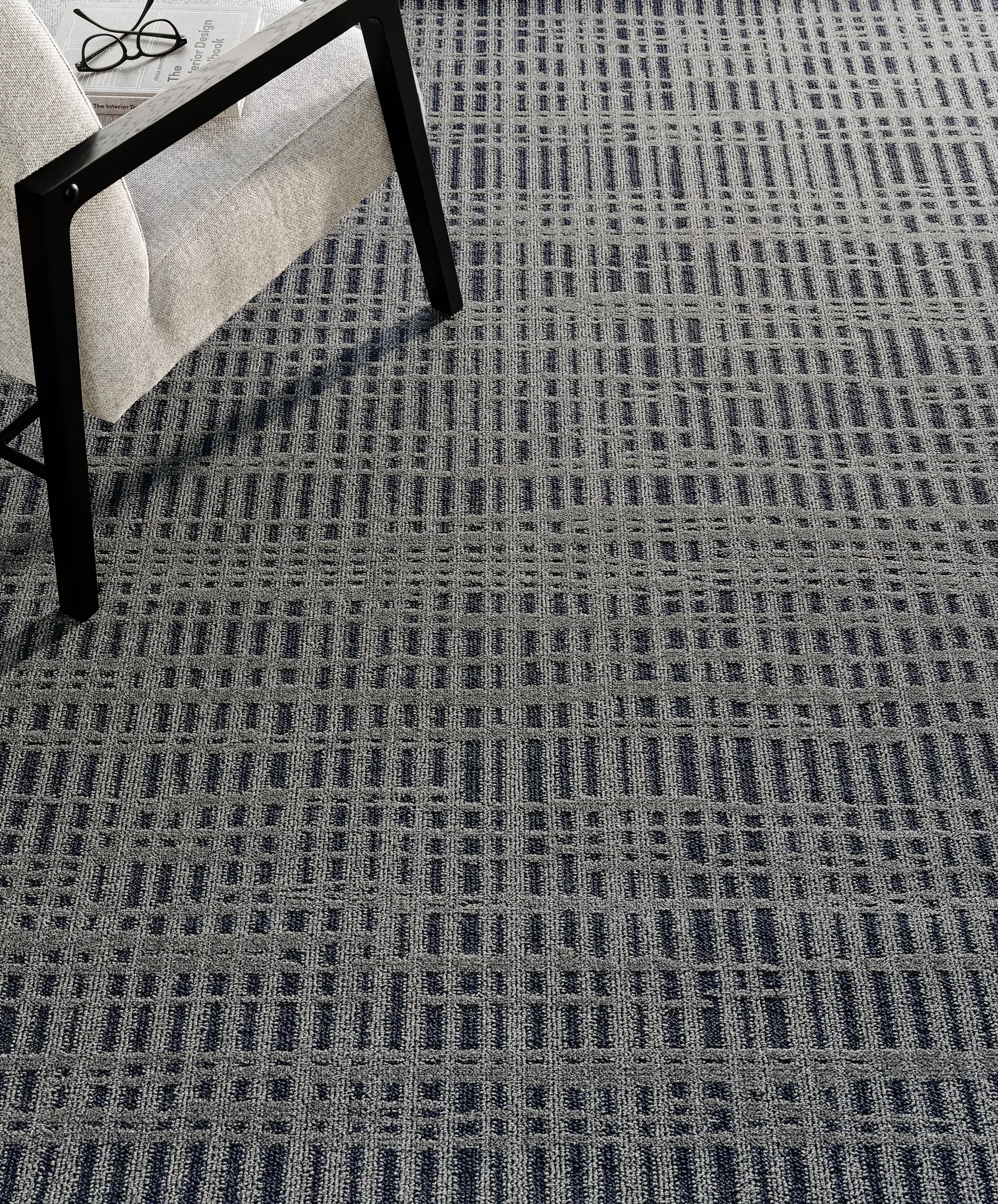 Broadloom carpet in a modern living room with a geometric pattern