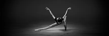 Graceful dance performance on luxury vinyl flooring Elegant dancer performing on a sleek vinyl floor in a dimly lit room