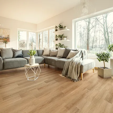 Wood Look Luxury Vinyl Plank Flooring in Contemporary Living Room Modern living room with large windows, grey sectional sofa, and wood look luxury vinyl plank flooring