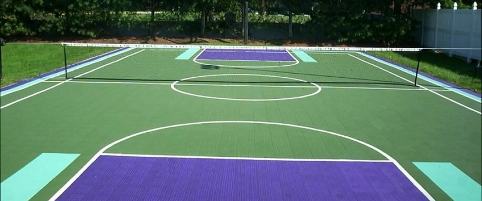 Outdoor sports court with green and purple flooring