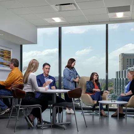Contemporary Office Space with Stylish Flooring Modern workplace meeting area with large windows and sleek flooring