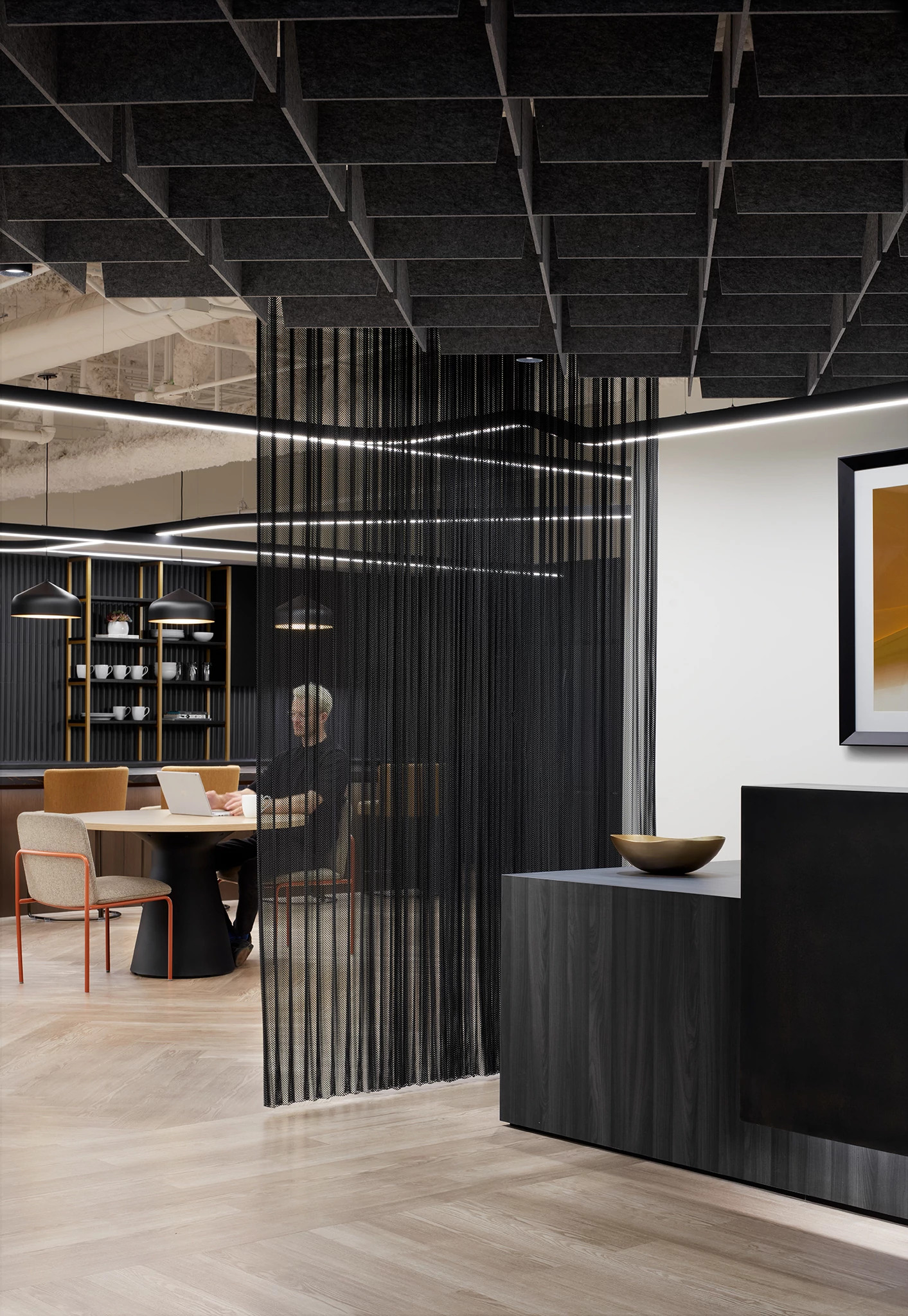 Modern workplace interior with heavy commercial luxury vinyl tile flooring, featuring a 48x6 inch dimension, and a stylish ceiling design.