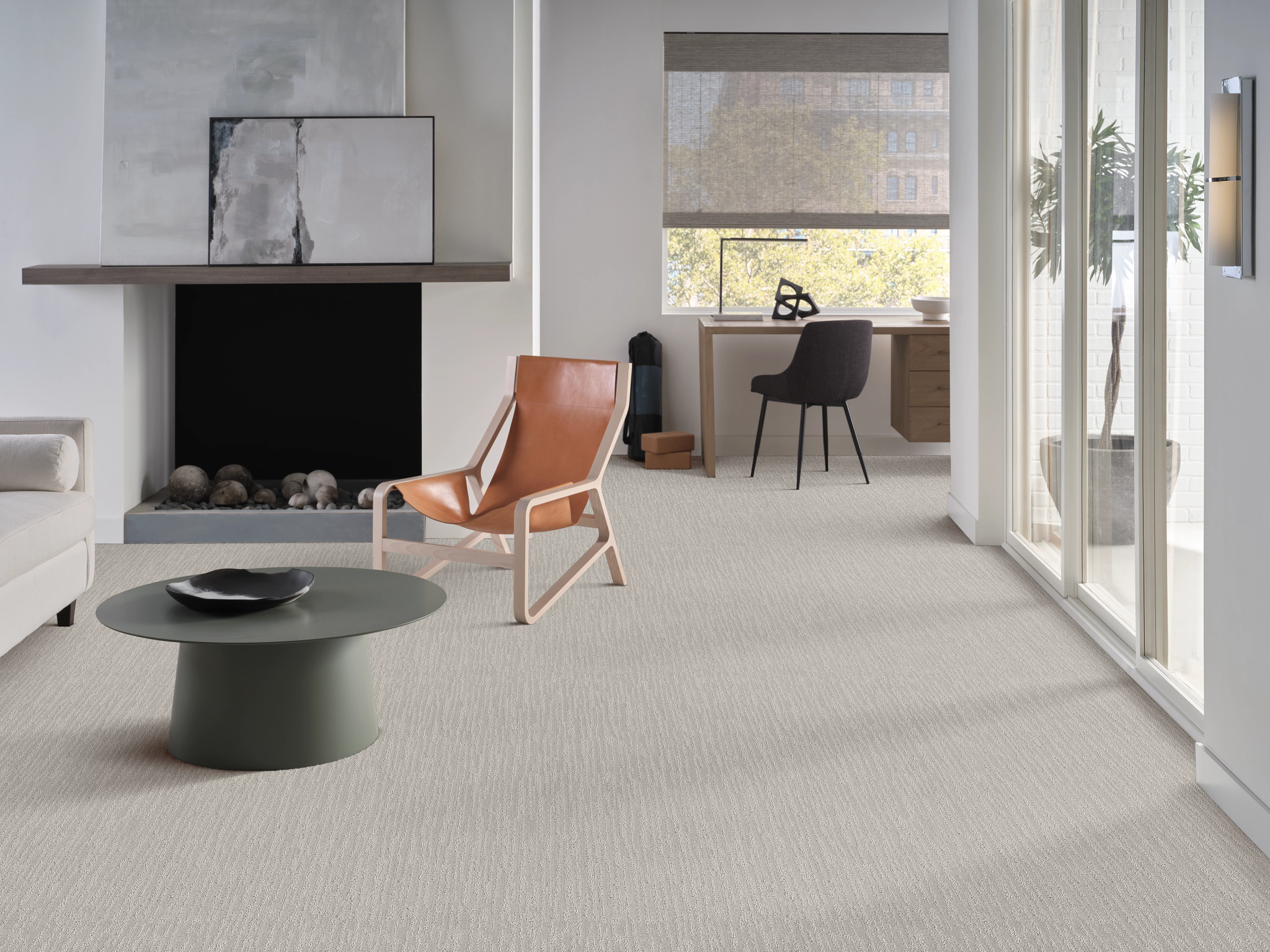 High-end living room with modern furniture, art and beautiful textured carpet.