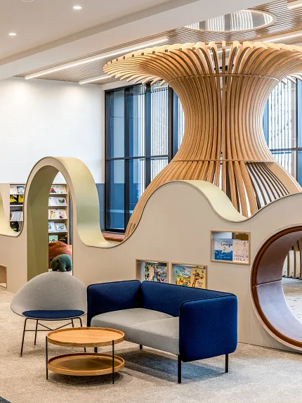 Stylish soft surface flooring in contemporary library design Modern library interior with soft surface flooring and curved shelving