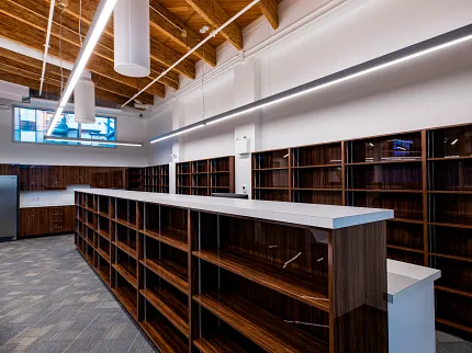 Retail Space with Commercial Carpet Tile Flooring Retail space with wooden ceiling and commercial carpet tile flooring in a 24x24 inch pattern