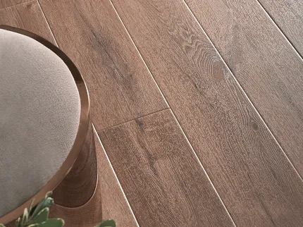 Warm Brown Wood Look Luxury Vinyl Plank Flooring - Durable and Scratch Resistant Wood look luxury vinyl plank flooring in warm brown tones with visible wood grain texture