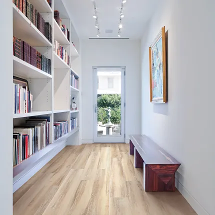 Coretec Residential WPC flooring for stylish interiors Light wood look vinyl flooring in a modern hallway with bookshelves
