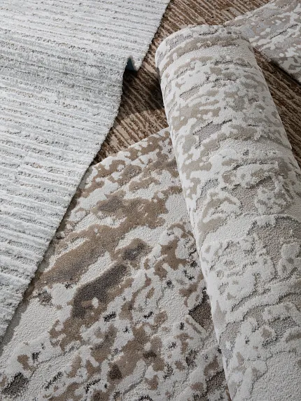 image of small rolls of patterned carpet several loose rolls of carpet in exquisite patterns