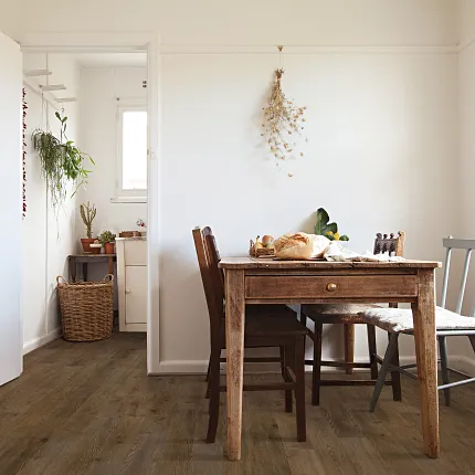 Stylish wood look vinyl flooring for cozy home interiors Rustic dining room with Coretec Residential WPC vinyl flooring