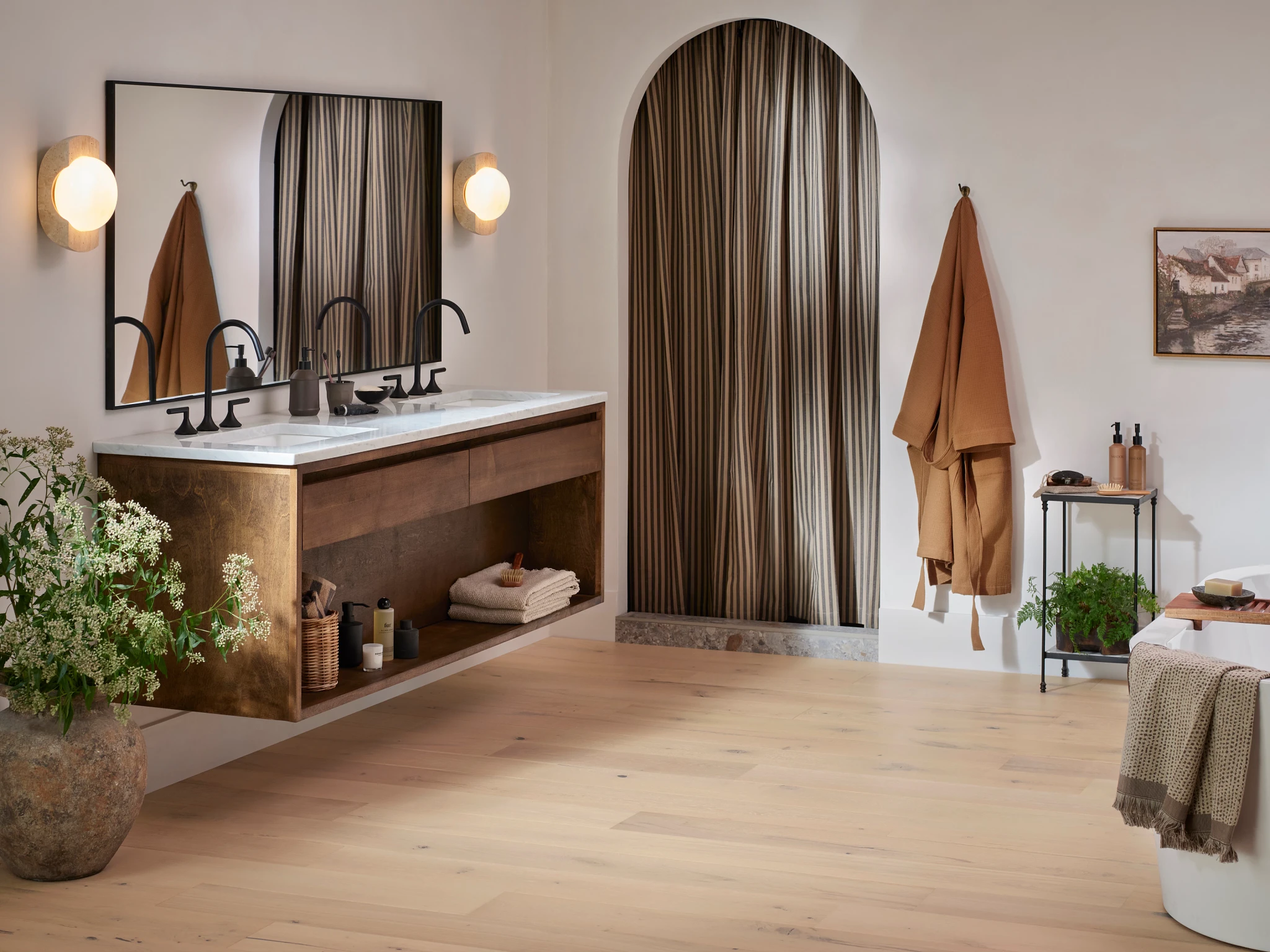 Elegant bathroom with light hardwood flooring