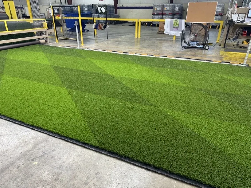 Green artificial turf in industrial setting