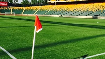 Artificial Turf Soccer Field with Stadium Seats Artificial turf soccer field with red corner flag and empty stadium seats