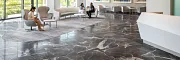 Healthcare Facility Lobby with Dark Marble Flooring and Modern Design Modern healthcare facility lobby with sleek white reception desk, contemporary seating, and large windows showcasing a view of greenery, featuring elegant dark marble flooring.