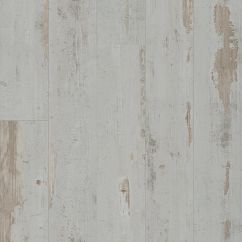 An off-white vinyl plank floor with brown rustic chatter 